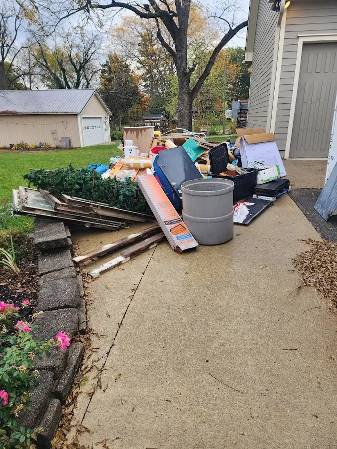 Dumpster being loaded with debris for Estate Cleanout Dumpster Rental in Painesville